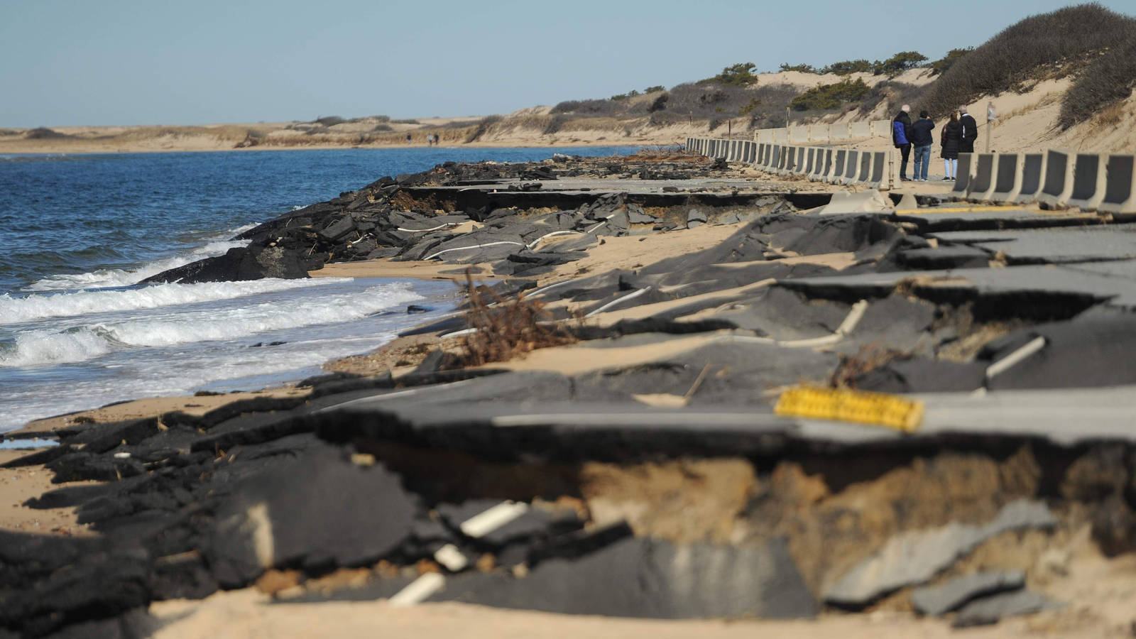 <p>Damage sustained to the Herring Cove Beach northern parking lot from winter storms bringing heavy shoreline erosion in 2018. Since then, the National Park Service has relocated the Herring Cove beach parking lot and bathhouse further inland to avoid future repairs.</p>