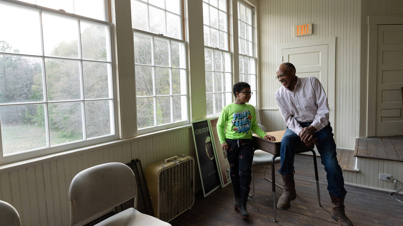 <p>Newell Quinton and his grandson, Zana Kone, in the San Domingo School in <br>Maryland, which Quinton, his siblings and his parents attended.</p>